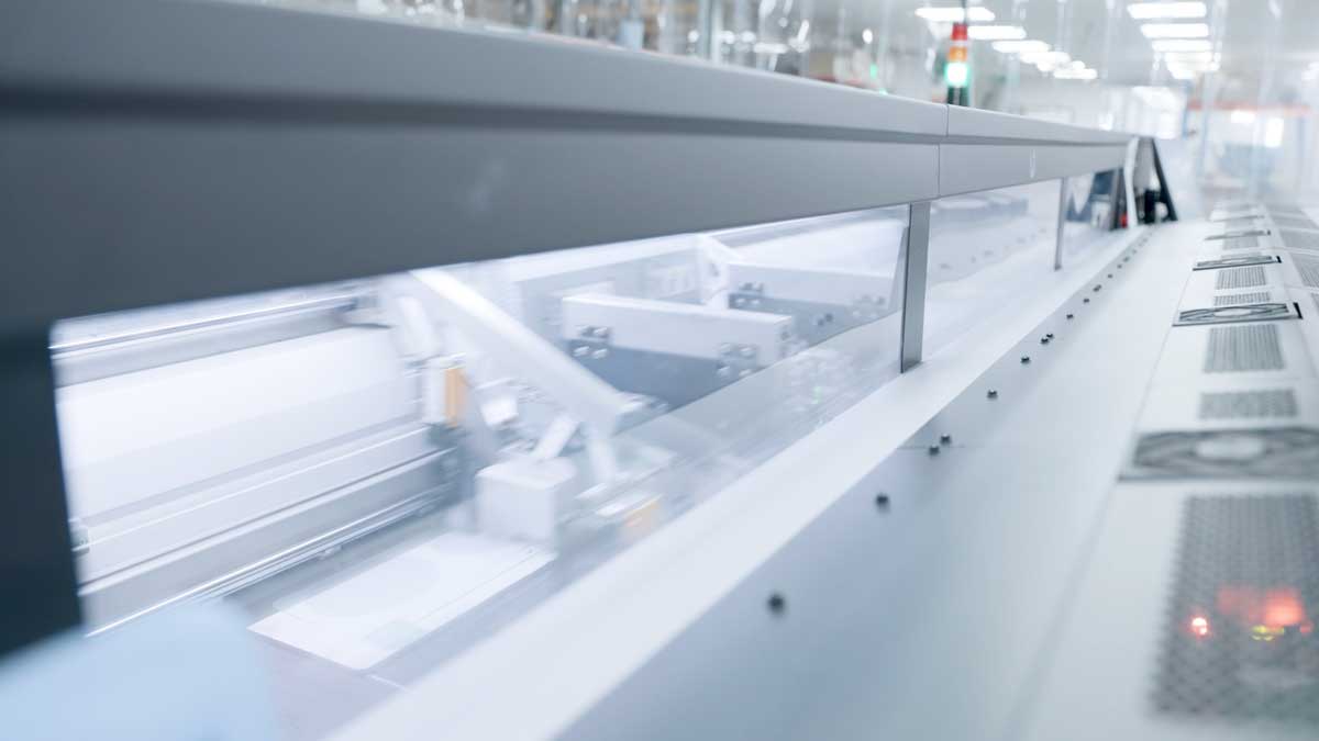 A number plate production line seen through its guard