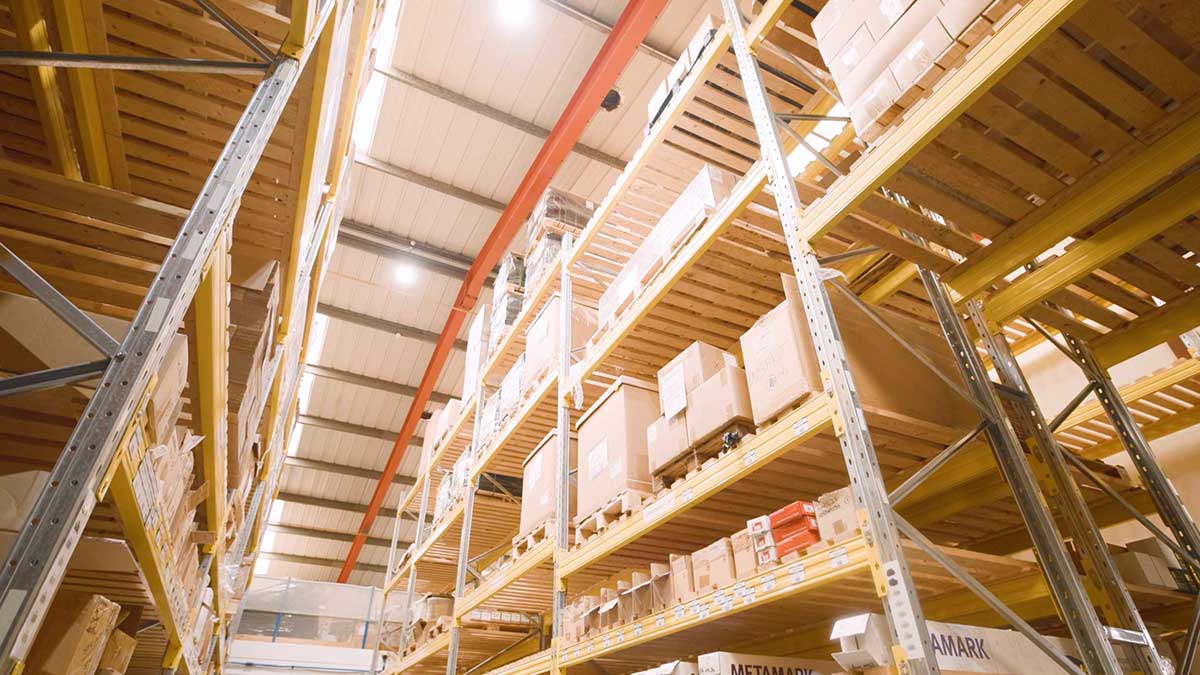 Tall warehouse racking stacked with boxed stock