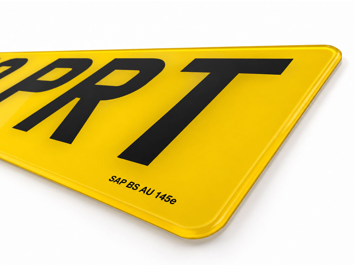 Close-up of the SAP BS AU 145e mark printed on a yellow rear plate