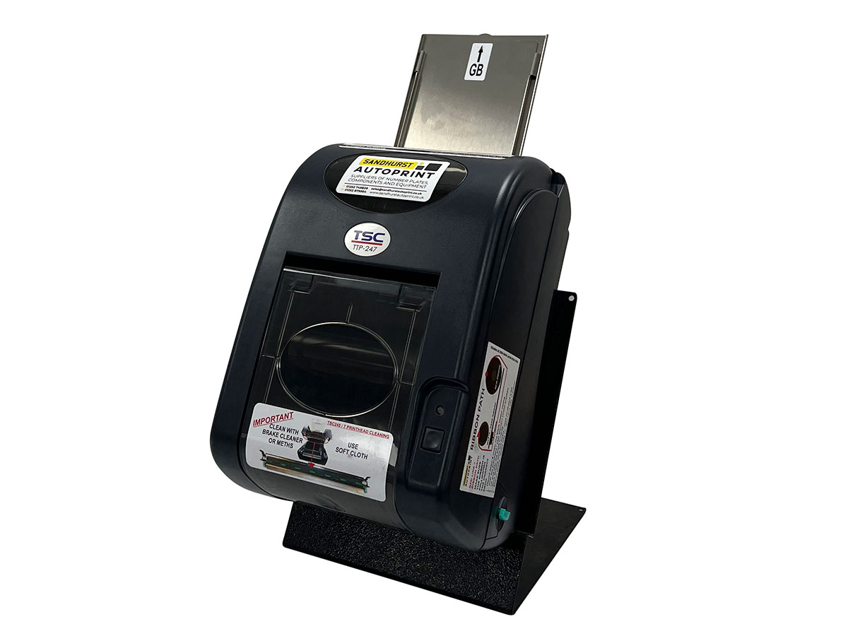 A TSC thermal printer feeding a yellow plate